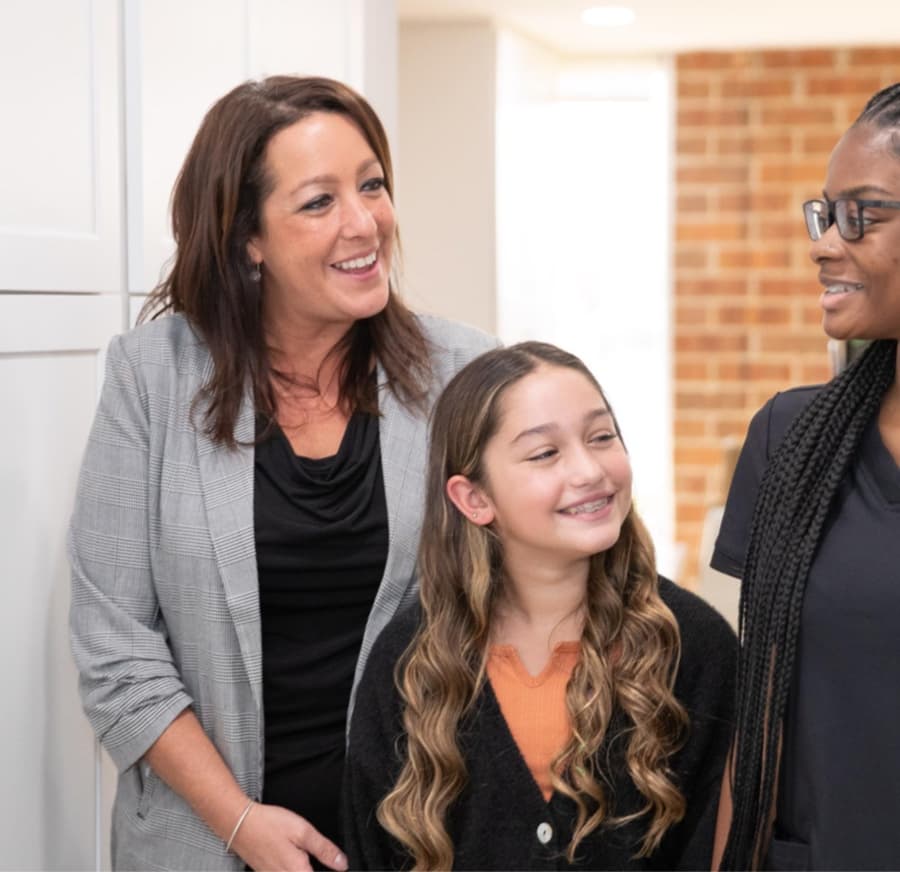 mother and daughter talking at front desk